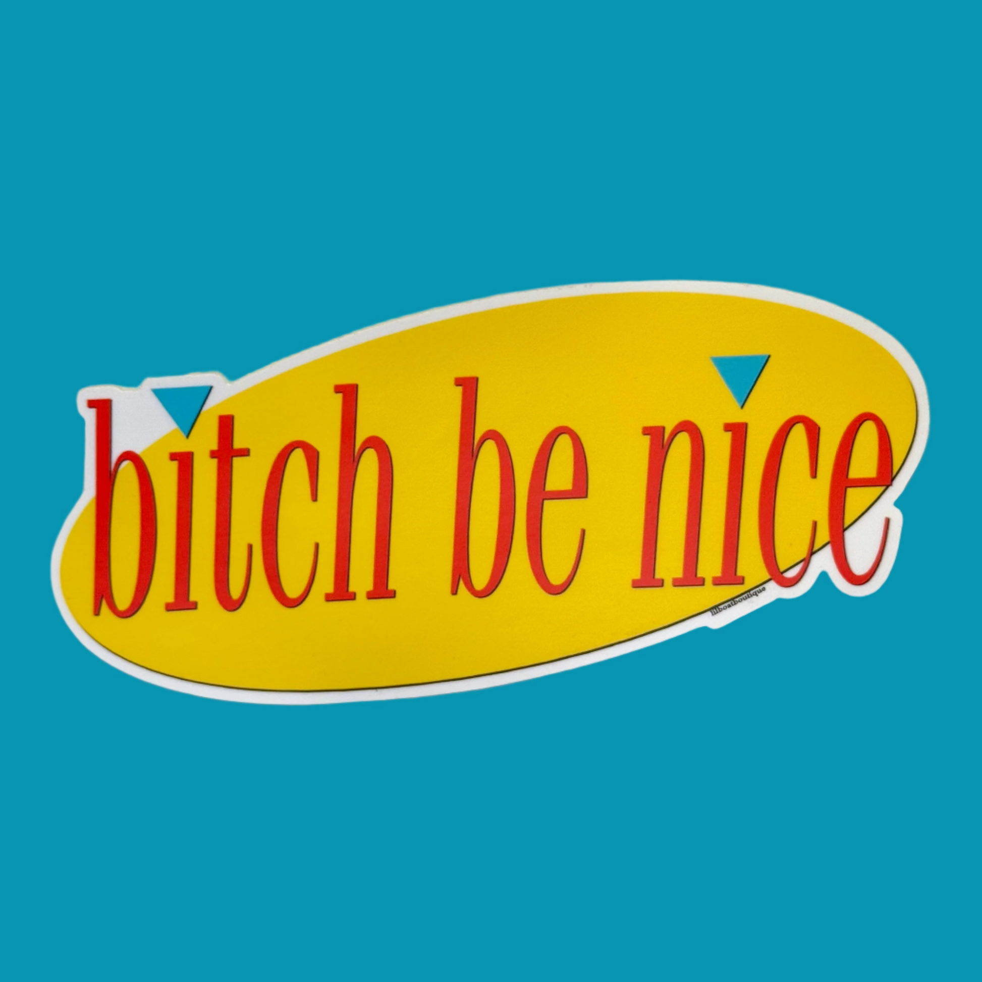 Sticker with 'bitch be nice' text on a yellow surface with white border. Text is red. 